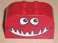 Part 4744pb09 - Slope, Curved 4 x 2 x 2 Double with 4 Studs with Monster Face with Black and White Eyes, Open Mouth Smile Pattern - De BrickPlaats