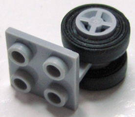 Part 4870c03 - Plate, Modified 2 x 2 Thin with Dual Wheels Holder - Split Pins with Light Bluish Gray Wheels and Black Tires (4870 / 4624 / 3139) - De BrickPlaats