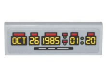 Part 63864pb201 - Tile 1 x 3 with Time Machine Digital Clock Yellow 'OCT 26 1985 01:20' Pattern (Sticker) - Set 10300 - De BrickPlaats