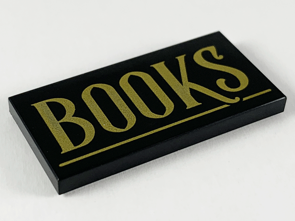 Part 87079pb0671 - Tile 2 x 4 with Gold 'BOOKS' and Underline Pattern - De BrickPlaats